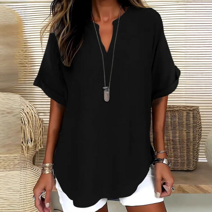 Blouse ample femme, col V, manches courtes. Confort décontracté, ourlet arrondi. Parfaite pour l'été.