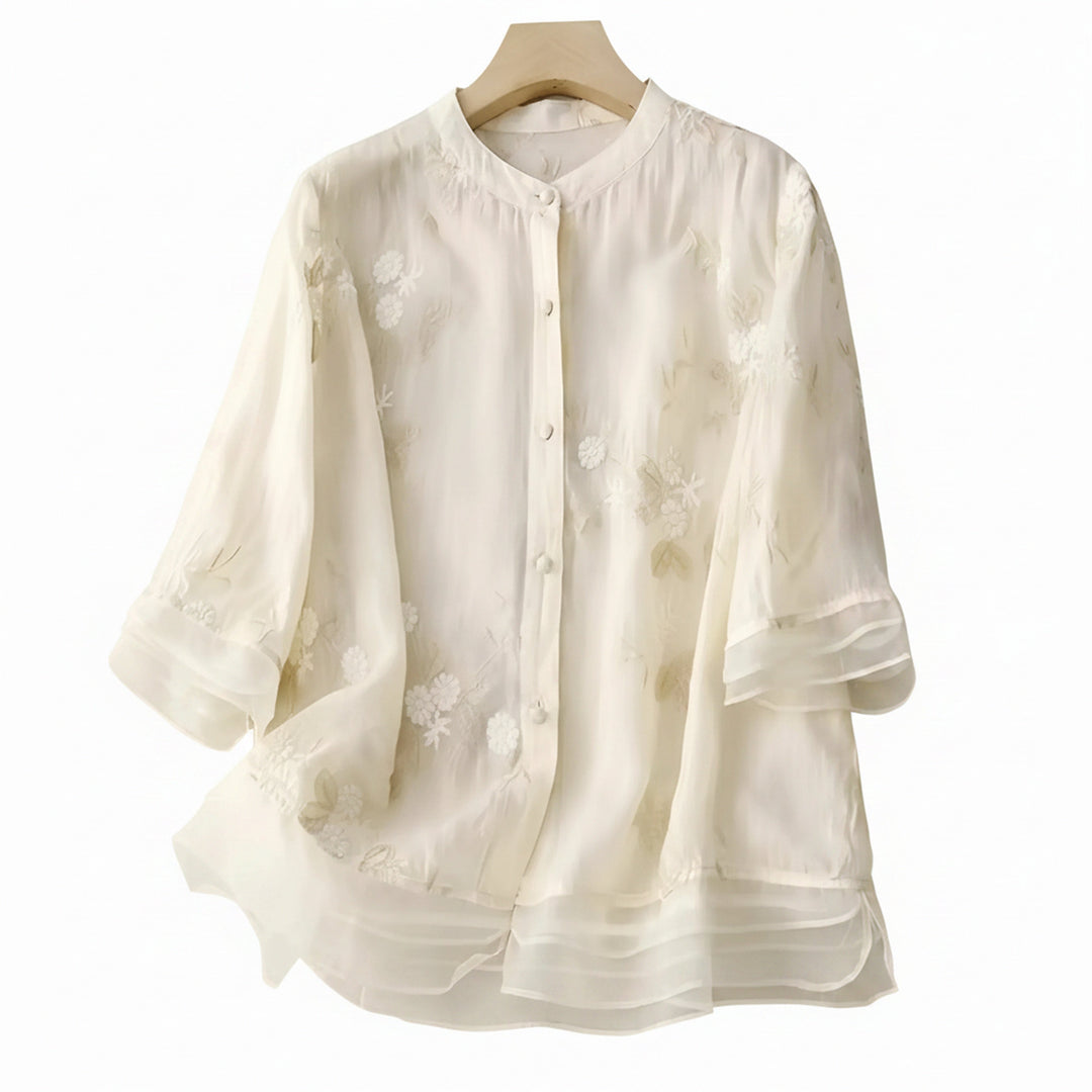 Blouse femme fluide chic à broderie florale délicate. Idéale pour printemps et été.