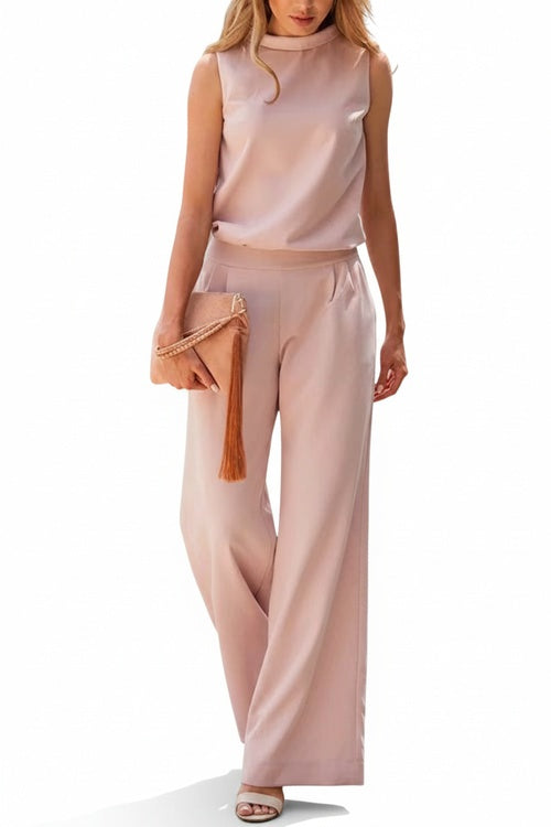 Ensemble deux-pièces femme chic et élégant avec top col montant sans manches et pantalon large fluide pour bureau ou soirée.