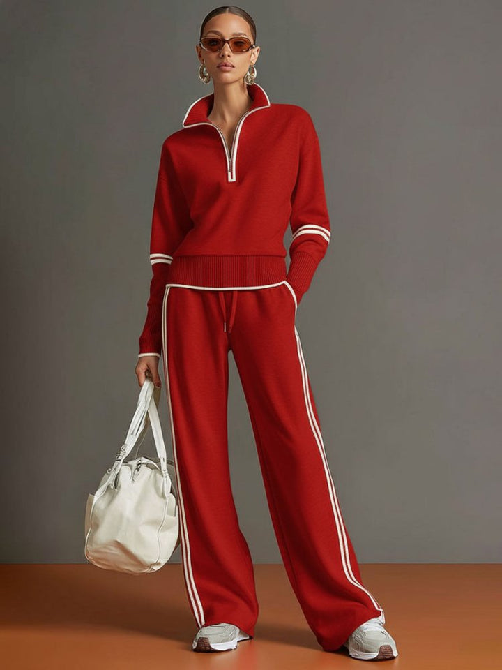 Femme portant un ensemble loungewear moderne, haut col zippé et pantalon large élégant, idéal pour la détente.