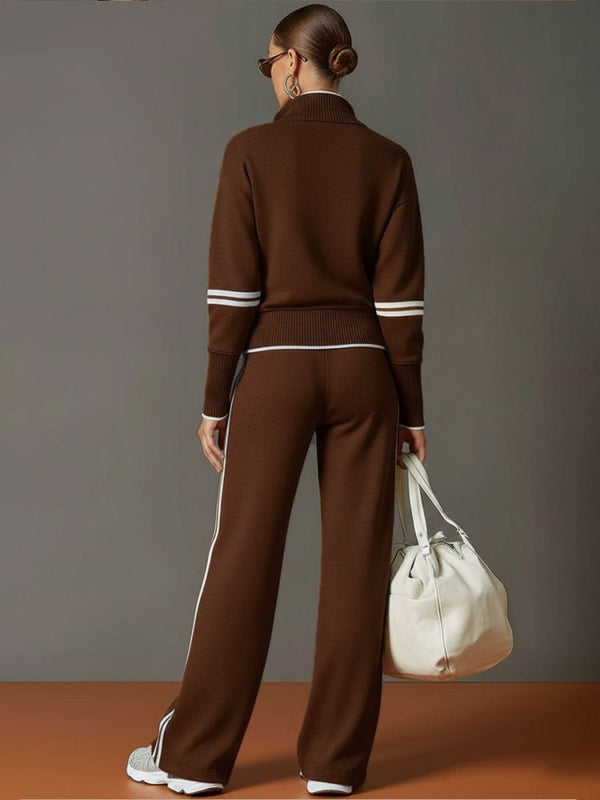 Homewear femme élégant, ensemble col zippé et pantalon large, bandes contrastées, pour un look sport chic moderne.