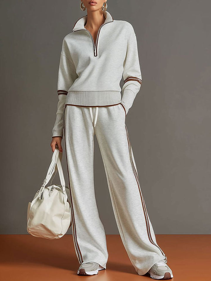 Ensemble femme confort décontracté, loungewear à col zippé et pantalon large fluide, parfait pour se relaxer.