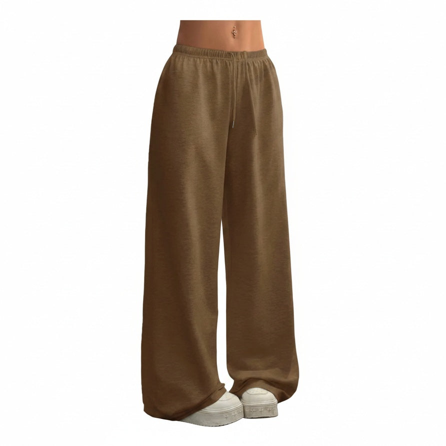 Pantalon de jogging femme large, taille élastique et cordon. Confortable et décontracté, idéal pour le sport.
