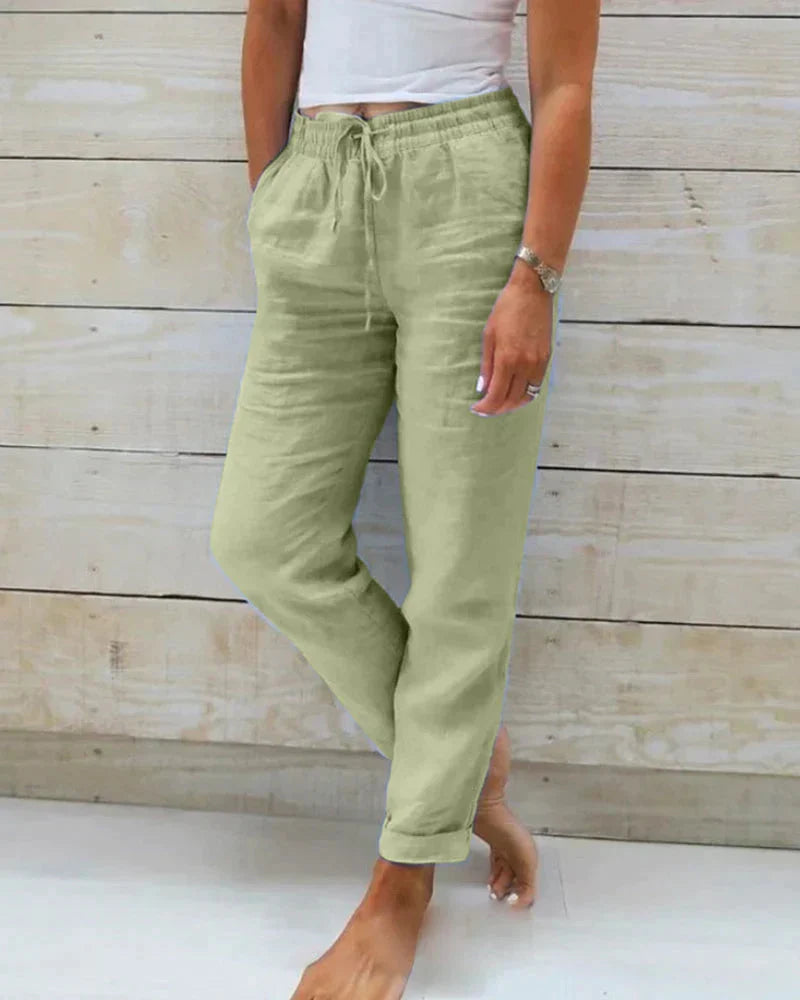 Pantalon femme long et décontracté, taille élastique avec poches, parfait pour un look chic et confortable.