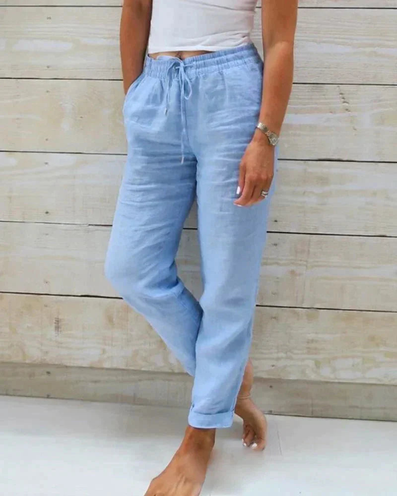 Pantalon long femme confortable avec taille élastique et cordon de serrage, pour une mode féminine élégante.