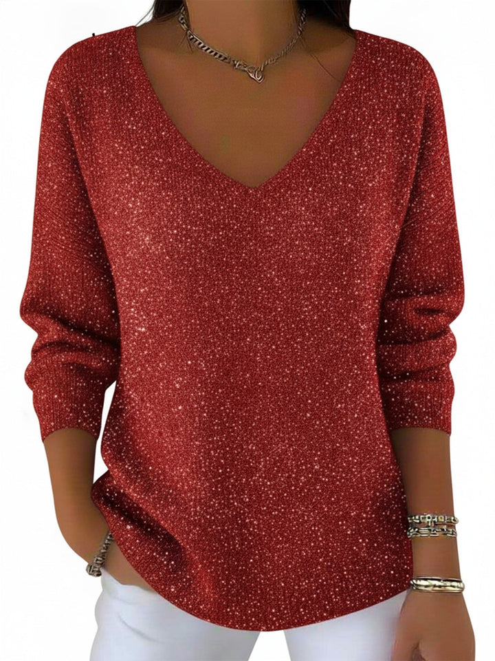 Pull femme scintillant noir, col V, manches longues. Idéal pour soirées élégantes et fêtes d'hiver chic.