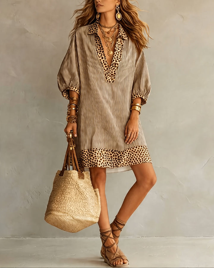Élégante robe chemisier mi-saison pour femme, manches bouffantes, motif léopard tendance.