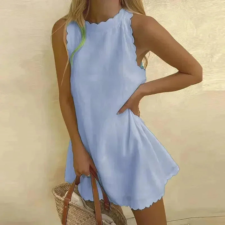 Robe courte femme festonnée et sans manches, style élégant. Idéale pour l'été, les vacances ou une sortie.