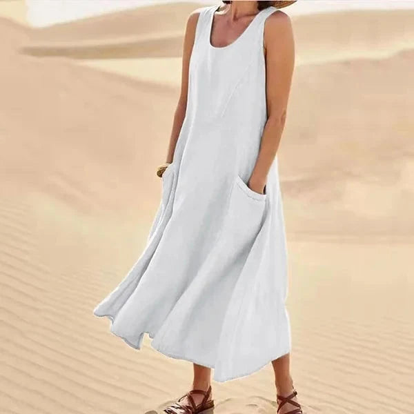Maxi robe femme sans manches avec poches pratiques, idéale pour un look bohème chic.