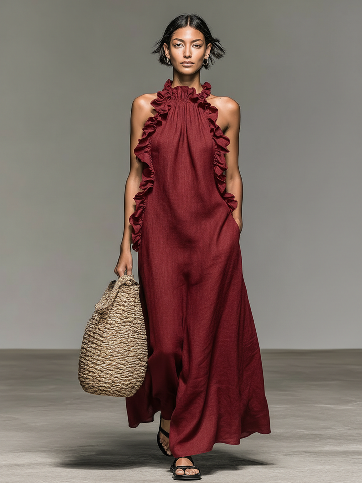 Robe fluide maxi confortable avec col halter et volants. Parfaite pour un style élégant et décontracté.