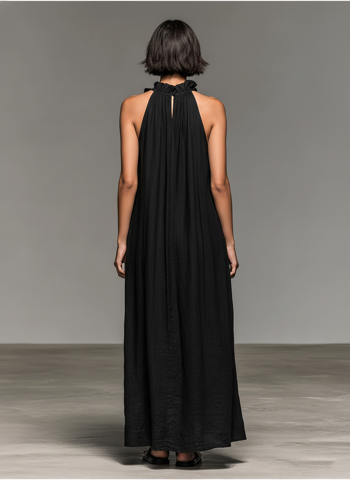 Robe longue décontractée pour femme, idéale plage/vacances. Silhouette fluide sans manches et volants.