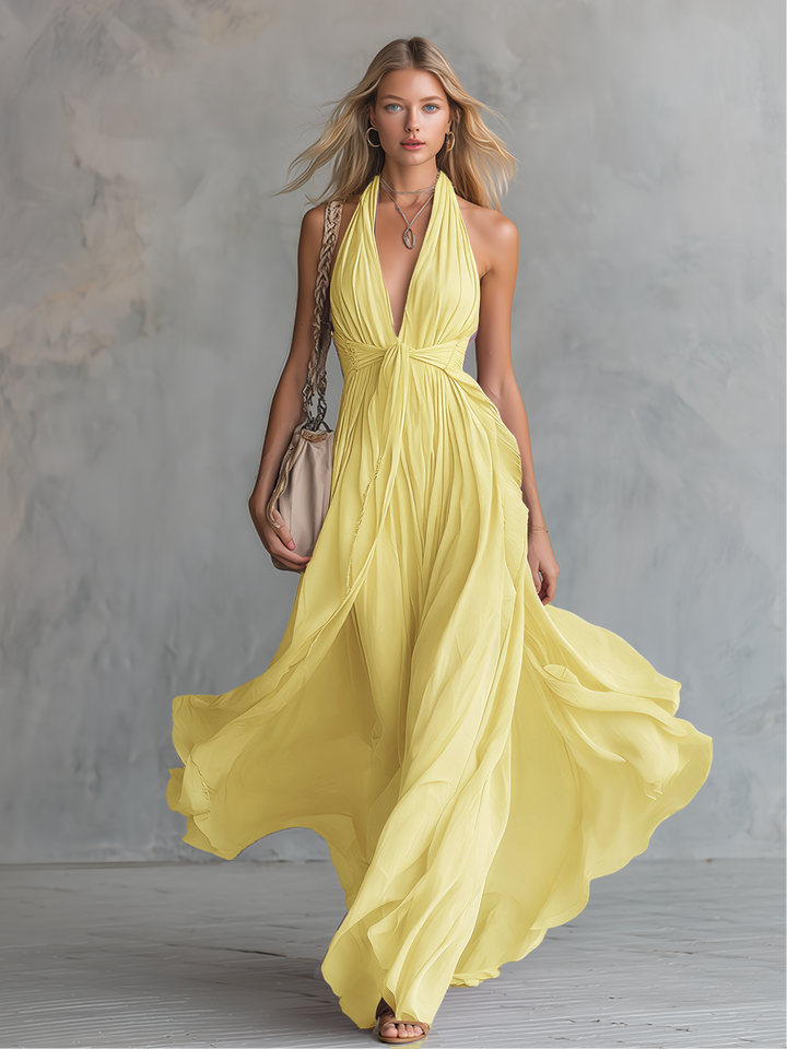 Robe maxi femme élégante violette, col halter plongeant, sans manches, coupe A-ligne. Idéale pour soirée et mariage.