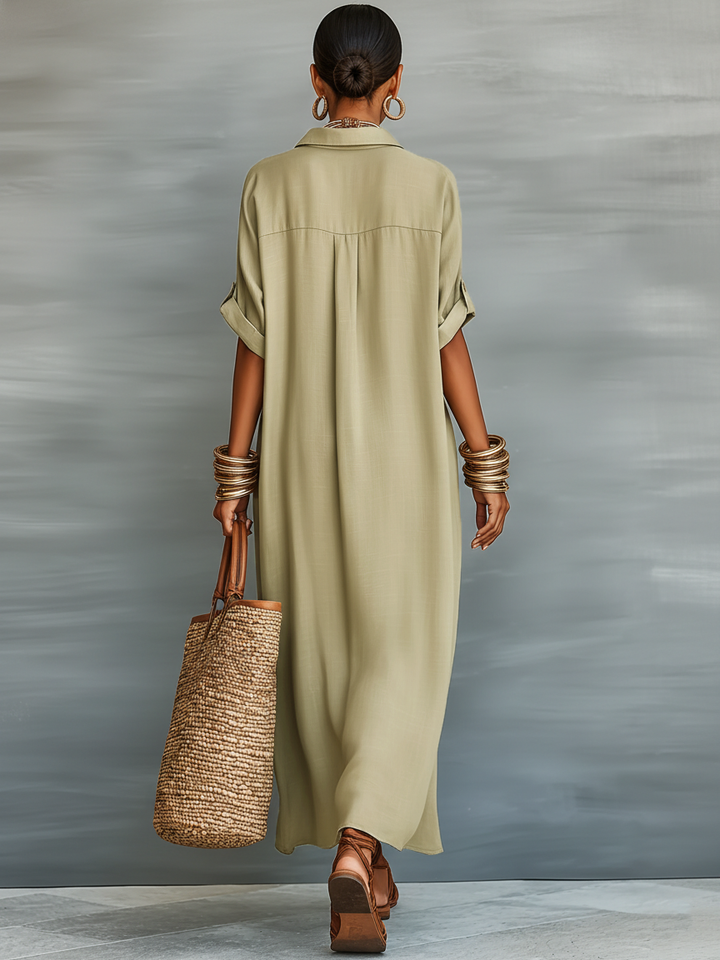 Robe maxi chic pour femme, coupe oversize et manches courtes. Style élégant et polyvalent pour toutes occasions.