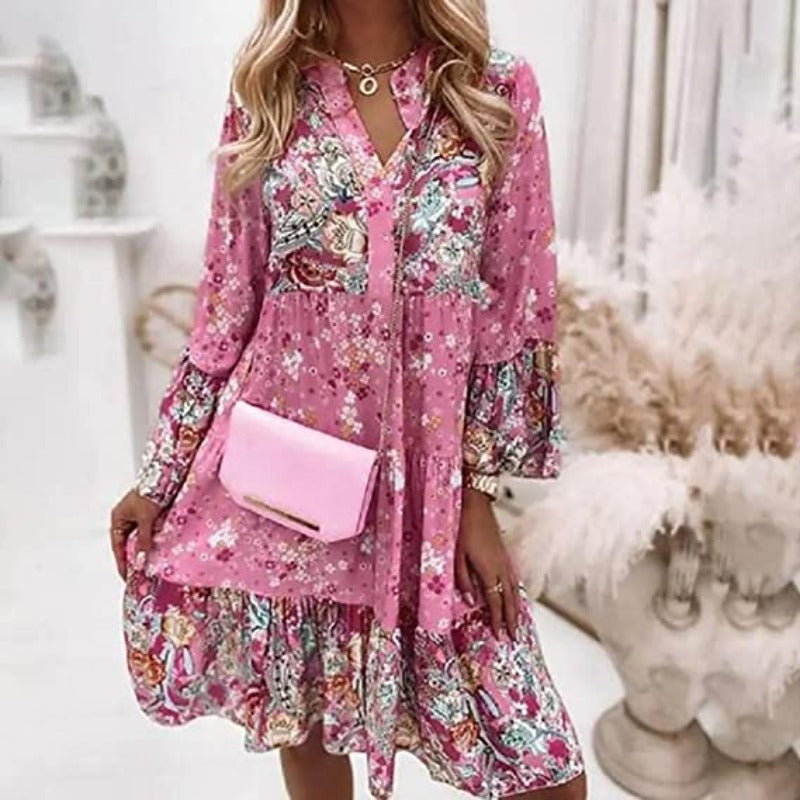 Robe midi florale style bohème, parfaite pour une tenue décontractée printemps-été. Manches longues.