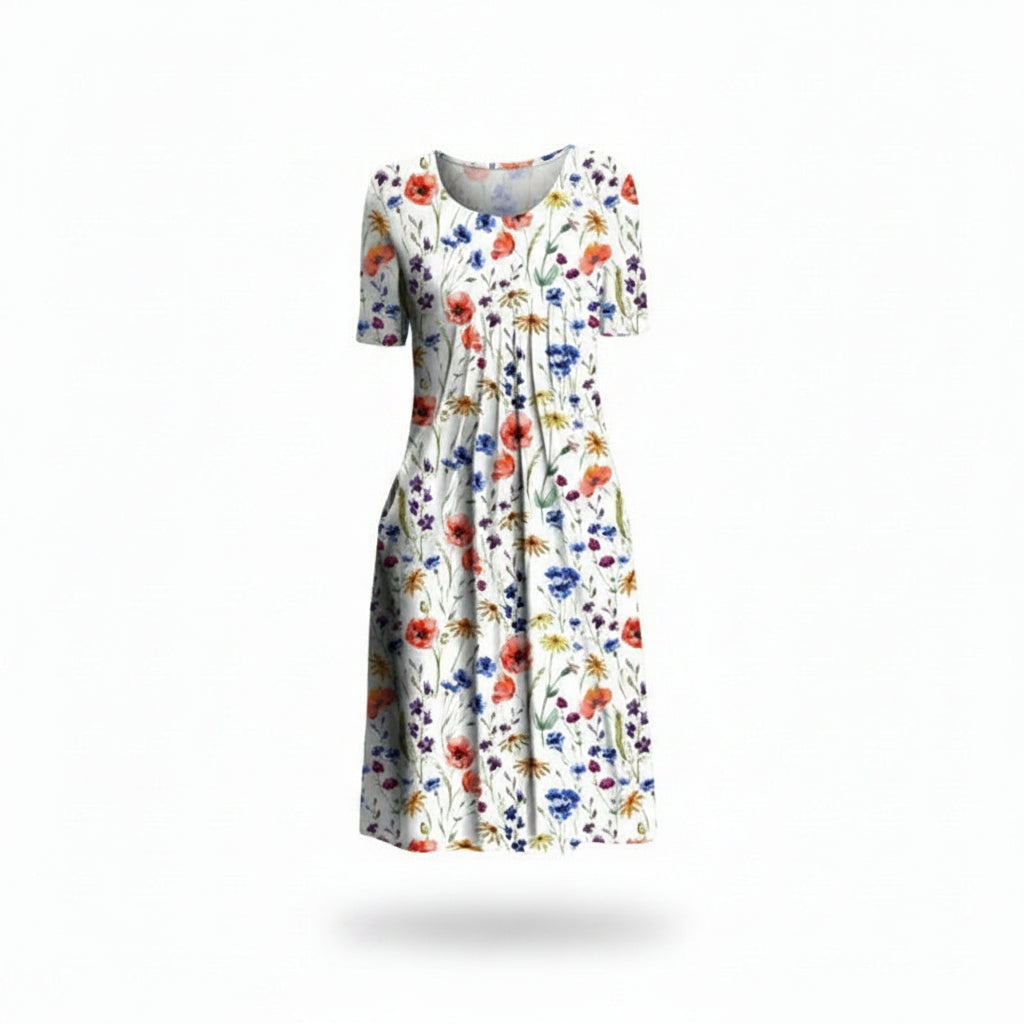 Robe midi fleurie femme, col rond, manches courtes, poches latérales. Style décontracté et fluide pour l'été.