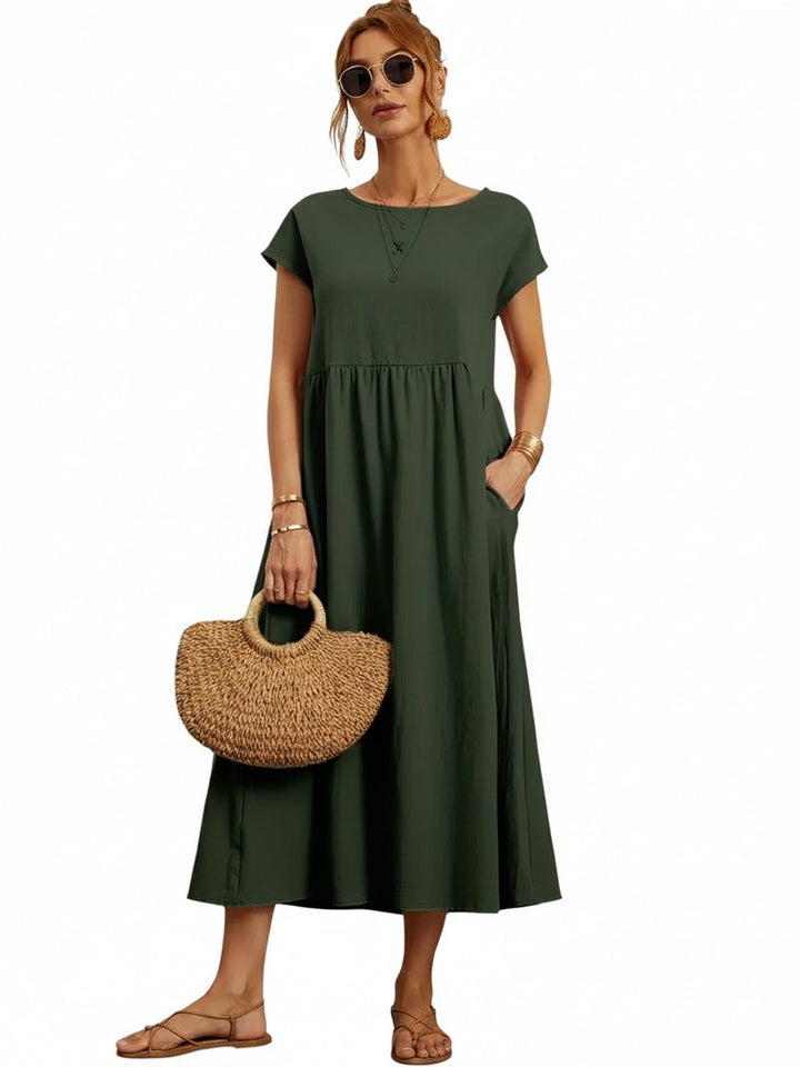 Robe midi femme décontractée, manches courtes, col rond et poches. Parfaite pour un look casual chic.