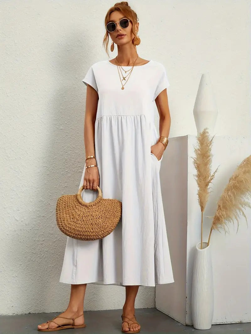 Mode femme : robe midi ample et fluide, manches courtes, col rond, poches. Idéale pour l'été.