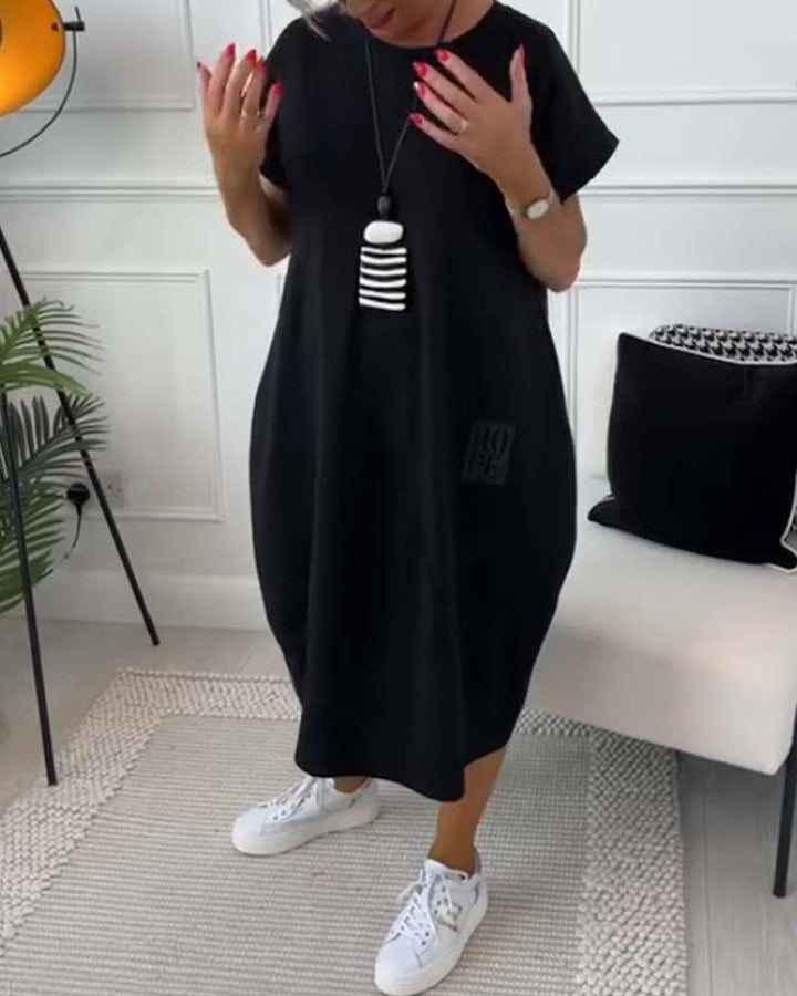 Polyvalente robe midi oversize femme, col rond, manches courtes, imprimé lettres. Parfaite quotidien.