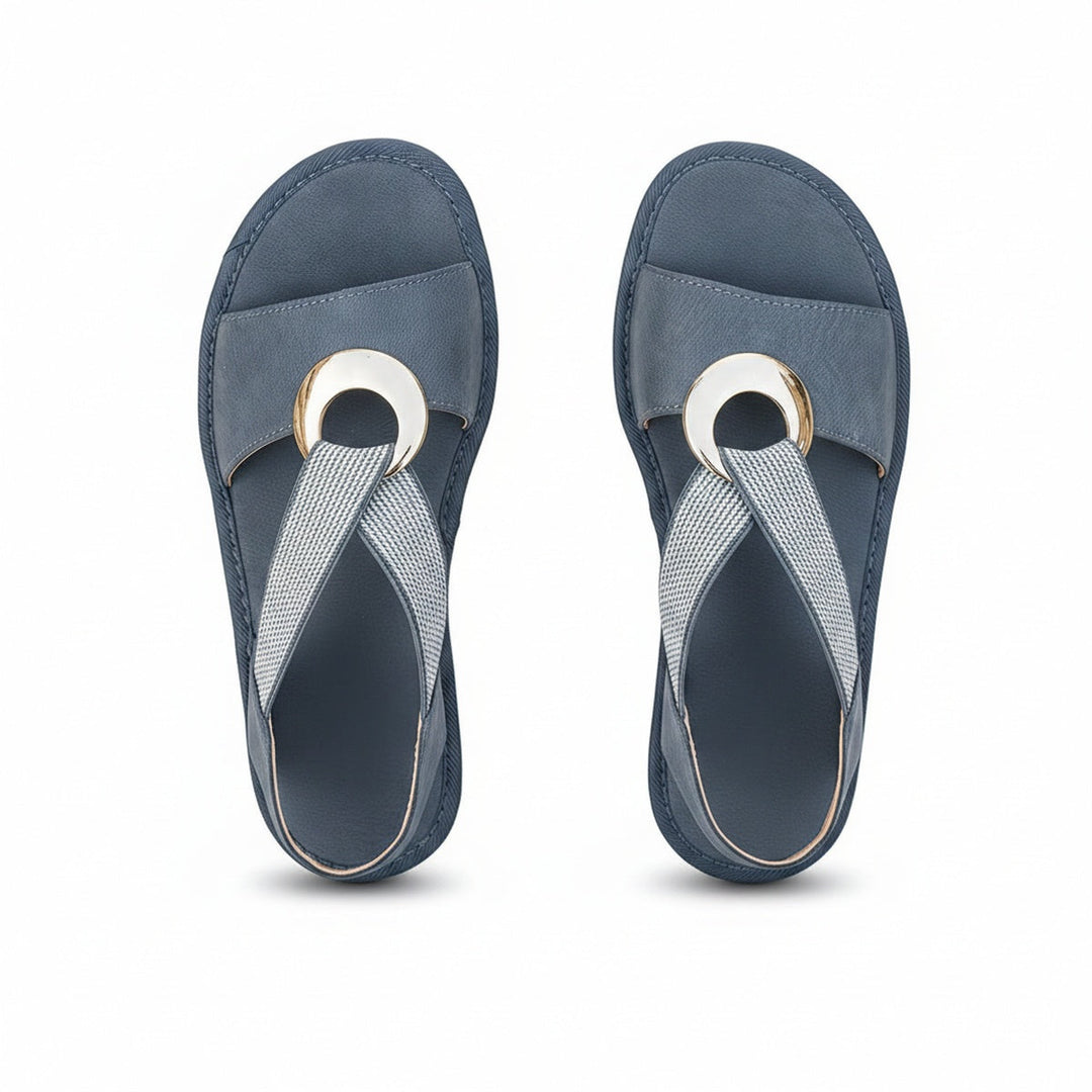 Sandales plates femme, bride élastique, anneau métallique. Confortables et style décontracté pour l'été.