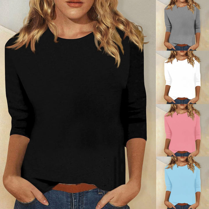 Top femme uni polyvalent à col rond et manches 3/4. Parfait pour le quotidien ou une tenue de bureau élégante.