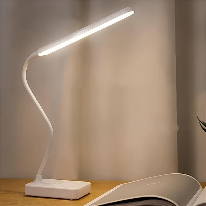 Lampe de lecture flexible et dimmable, rechargeable USB, offrant une lumière ajustable pour étudier.