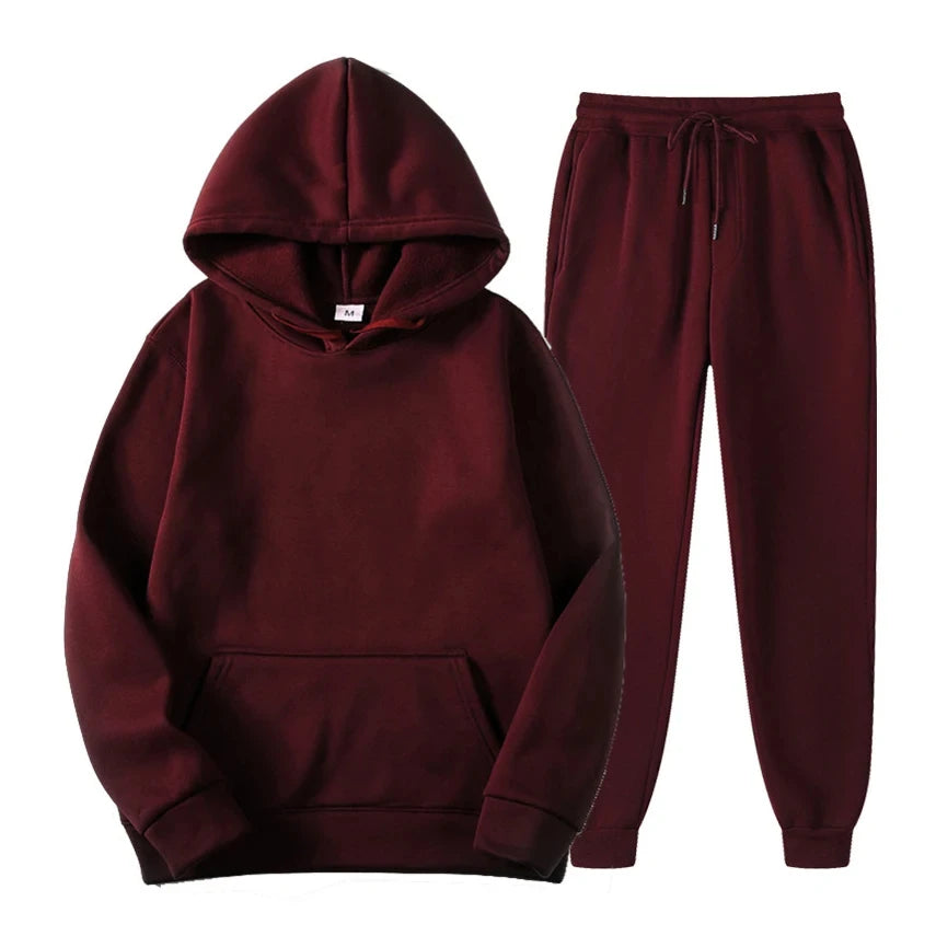 Survêtement homme sportswear gris, comprenant un sweat à capuche et un pantalon de jogging, parfait pour loisirs.