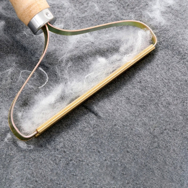 Outil de nettoyage réutilisable pour retirer poils d'animaux et peluches, entretien textile facile.