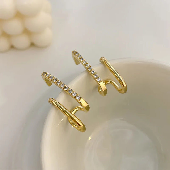 Boucles d'oreilles griffes cristal pour femmes, bijoux scintillants, audace et élégance.