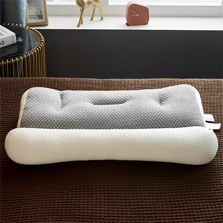 Coussin de sommeil ergonomique gris avec mousse à mémoire de forme. Confort et soutien pour la nuque et les cervicales.