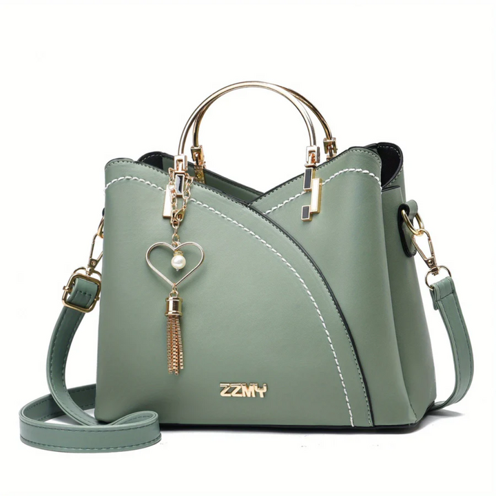 Sac à main femme, fermeture éclair dorée, détail élégant pour un look quotidien raffiné.