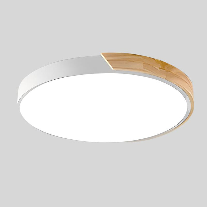 Applique Macaron avec touches de bois. Luminaire LED circulaire pour un éclairage doux.