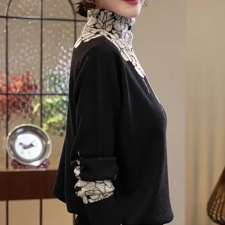 Pull femme à col roulé avec motif floral délicat. Un vêtement doux et confortable pour la mode hivernale.