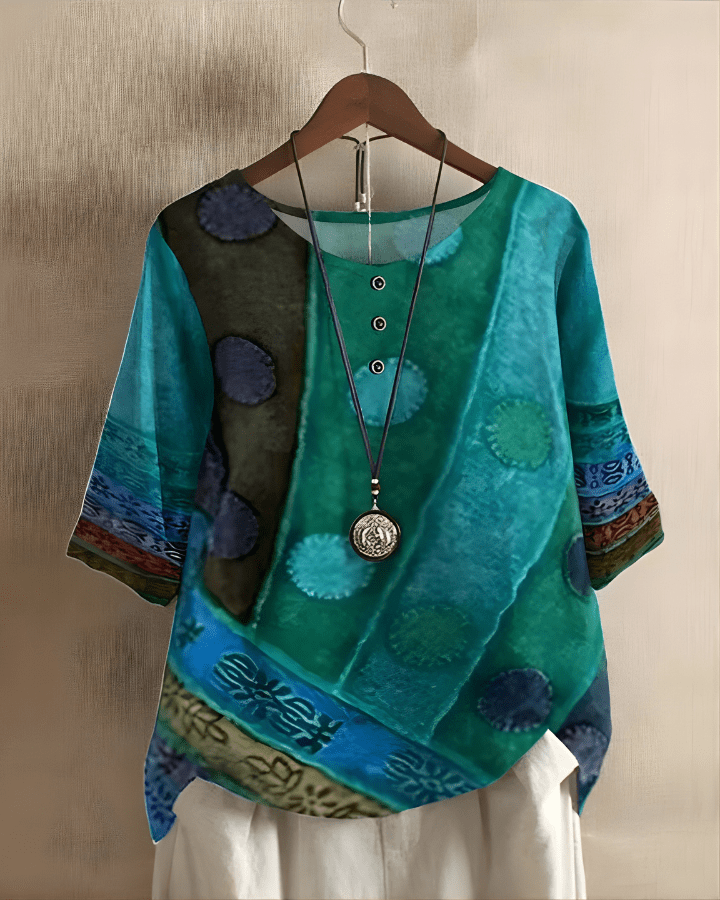 Blouse femme chic à imprimé géométrique. Manches trois-quarts, coupe ample. Parfaite pour la mode féminine décontractée.