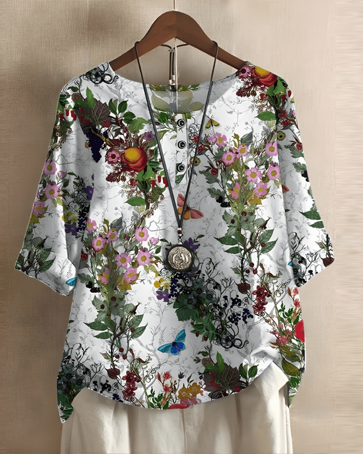 Blouse femme élégante et confortable à imprimé géométrique. Manches 3/4, idéale pour une tenue quotidienne raffinée.