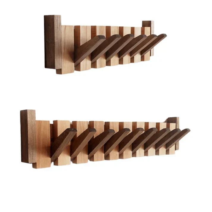 Porte-manteau mural design piano élégant. Patères escamotables pour entrée moderne, gain de place et organisation.