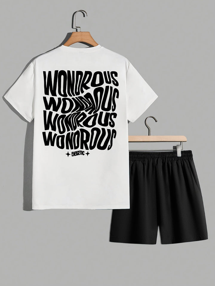 Tenue urbaine masculine : t-shirt graphique manches courtes motif psychédélique et short noir assorti.