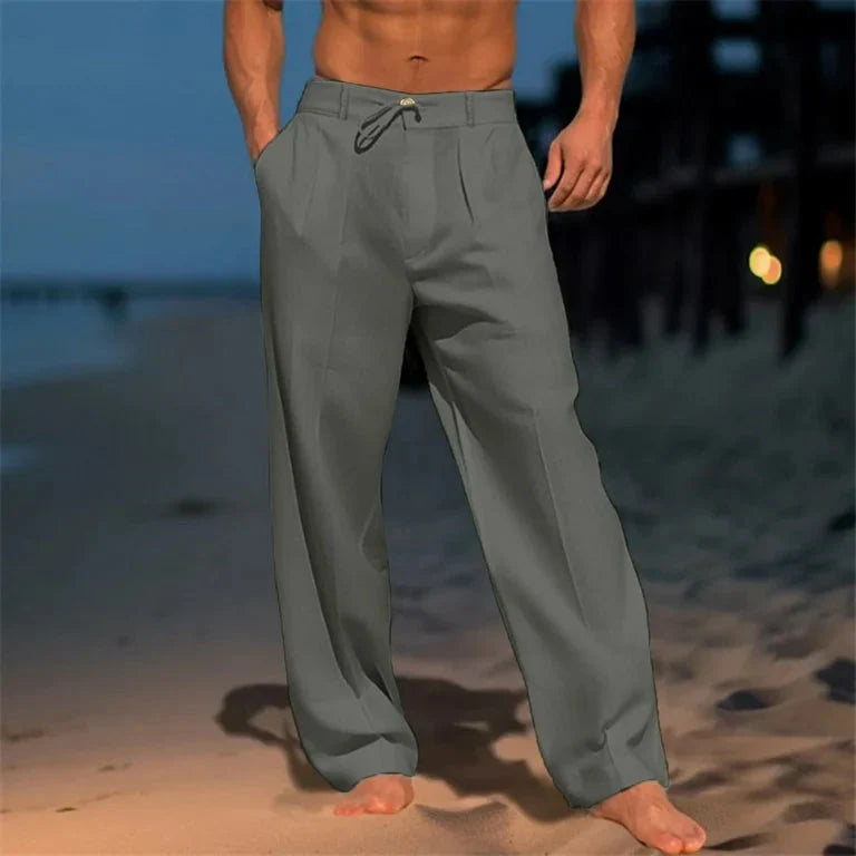 Pantalon large homme plissé beige avec cordon, idéal pour un look décontracté et confortable en été.