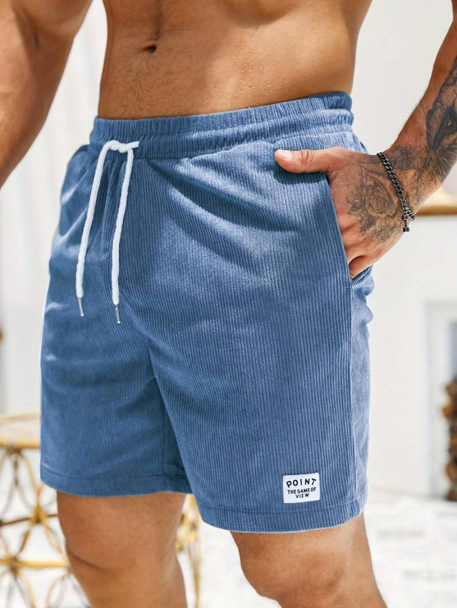 Ceinture élastique et cordon : short de bain homme côtelé offrant confort et ajustement parfait.