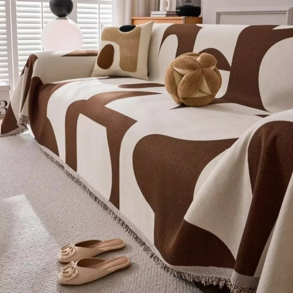 Housse de canapé géométrique moderne pour salon. Protection élégante et style contemporain.