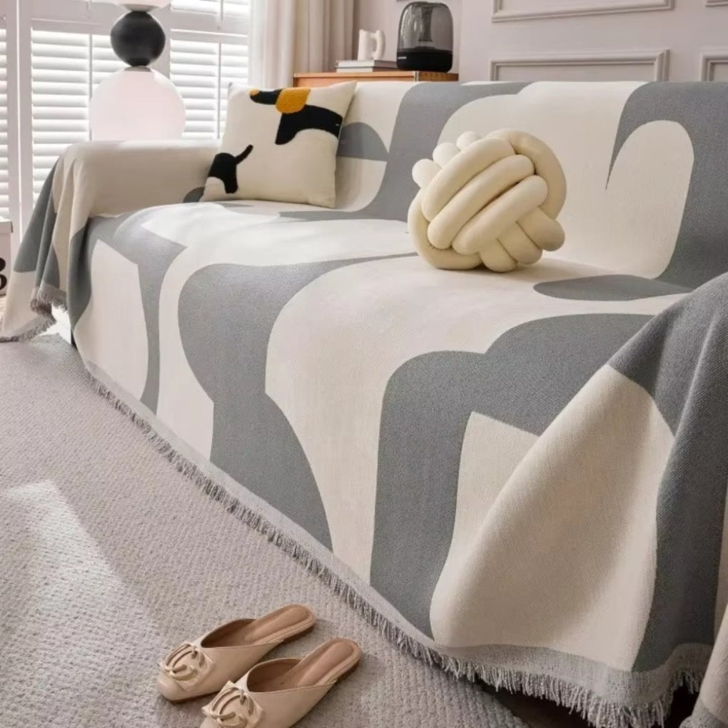Jeté de canapé géométrique, couverture design pour une décoration intérieure moderne et facile d'entretien.