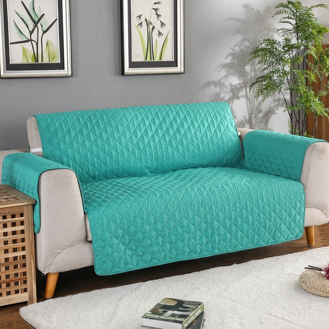 Housse de protection lavable pour canapé, anti-taches et poils d'animaux. Confort matelassé pour toute la famille.