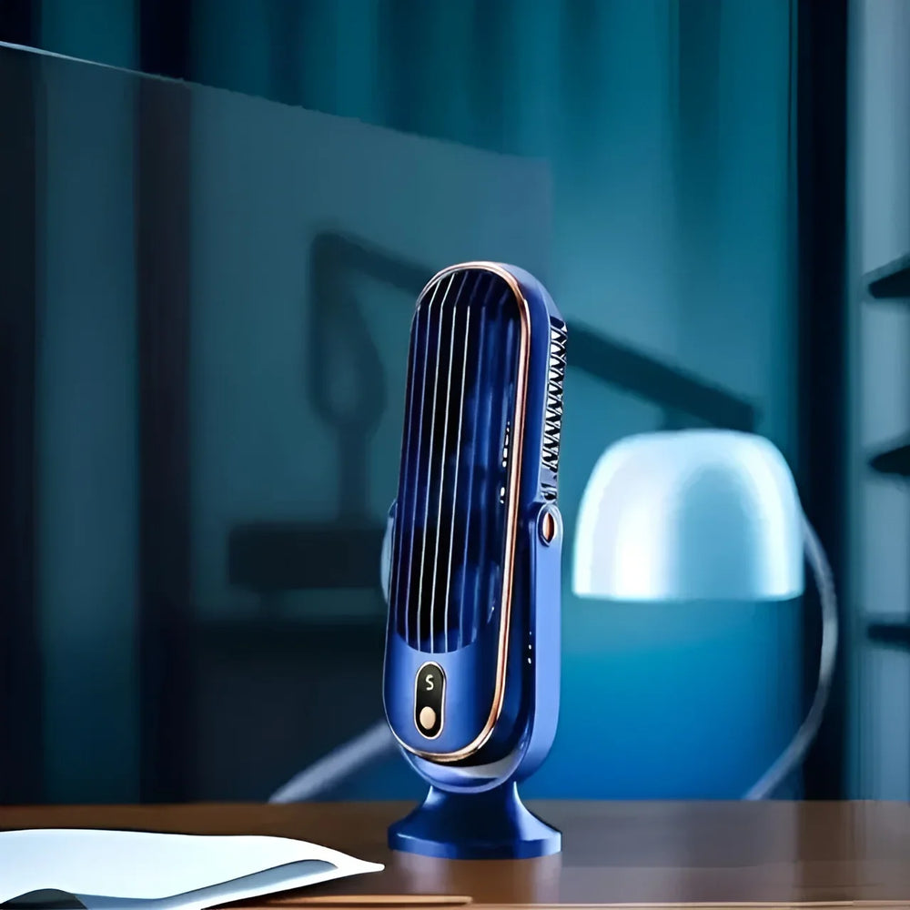 Mini climatiseur USB silencieux sur un bureau, idéal pour un rafraîchissement personnel efficace en été.
