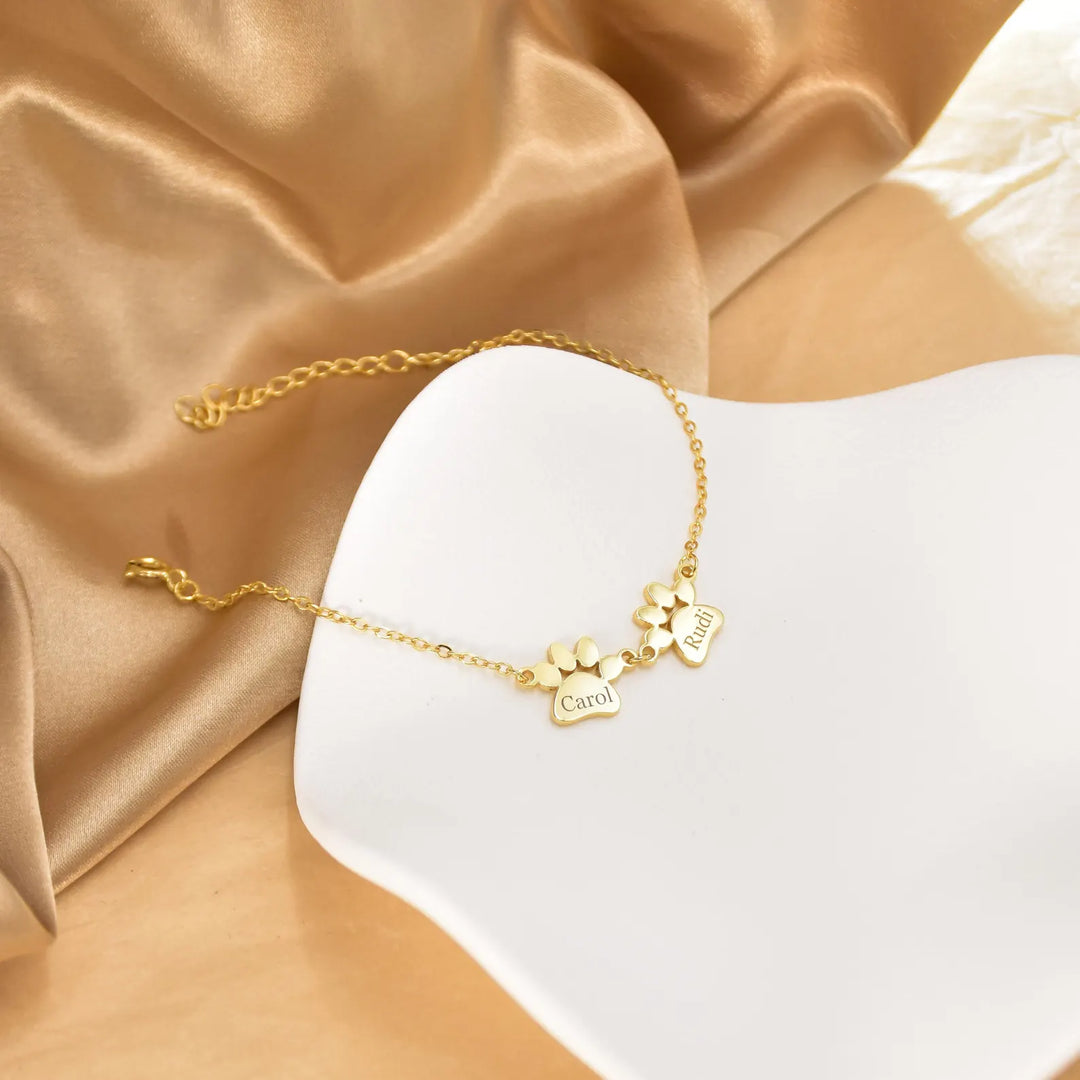 Bracelet personnalisé PawEmbrace en acier inoxydable, idéal pour amoureux des animaux avec gravure patte.