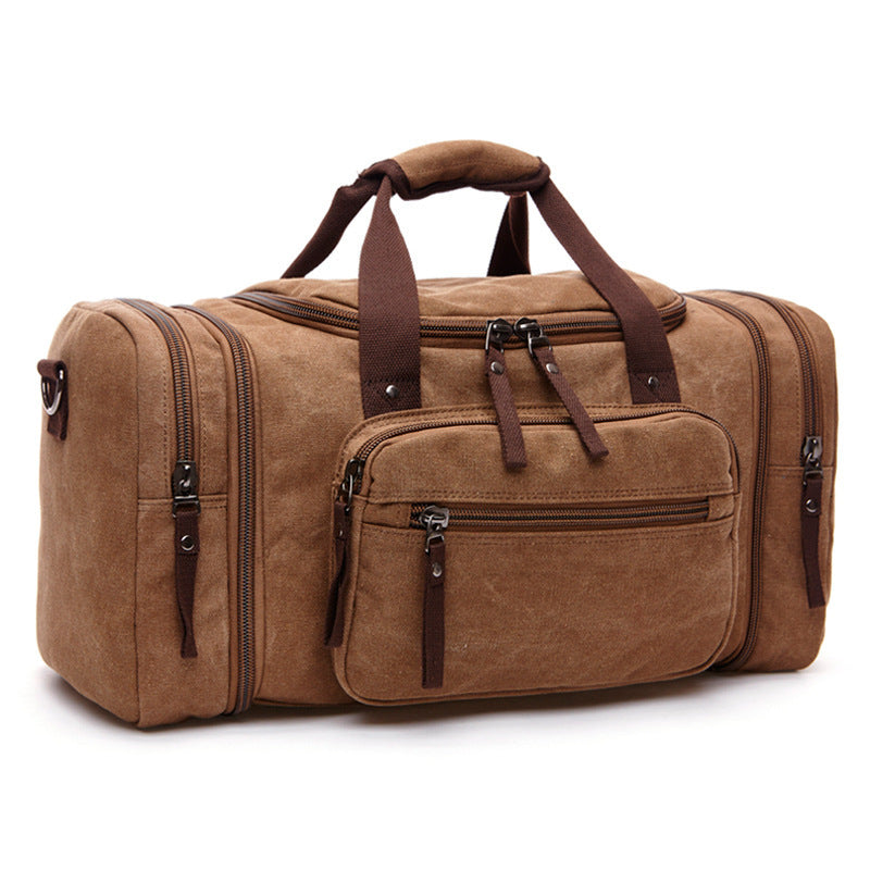 Grand sac de voyage homme en toile résistant avec bandoulière ajustable, parfait pour le weekend.