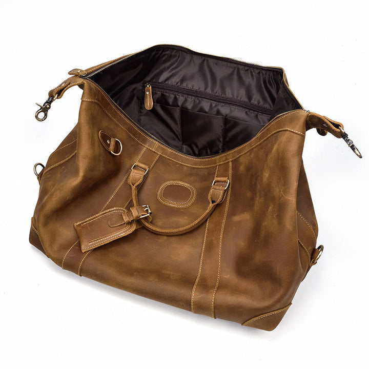 Sac duffel de voyage homme élégant en cuir marron vintage, grande capacité et fonctionnalité.