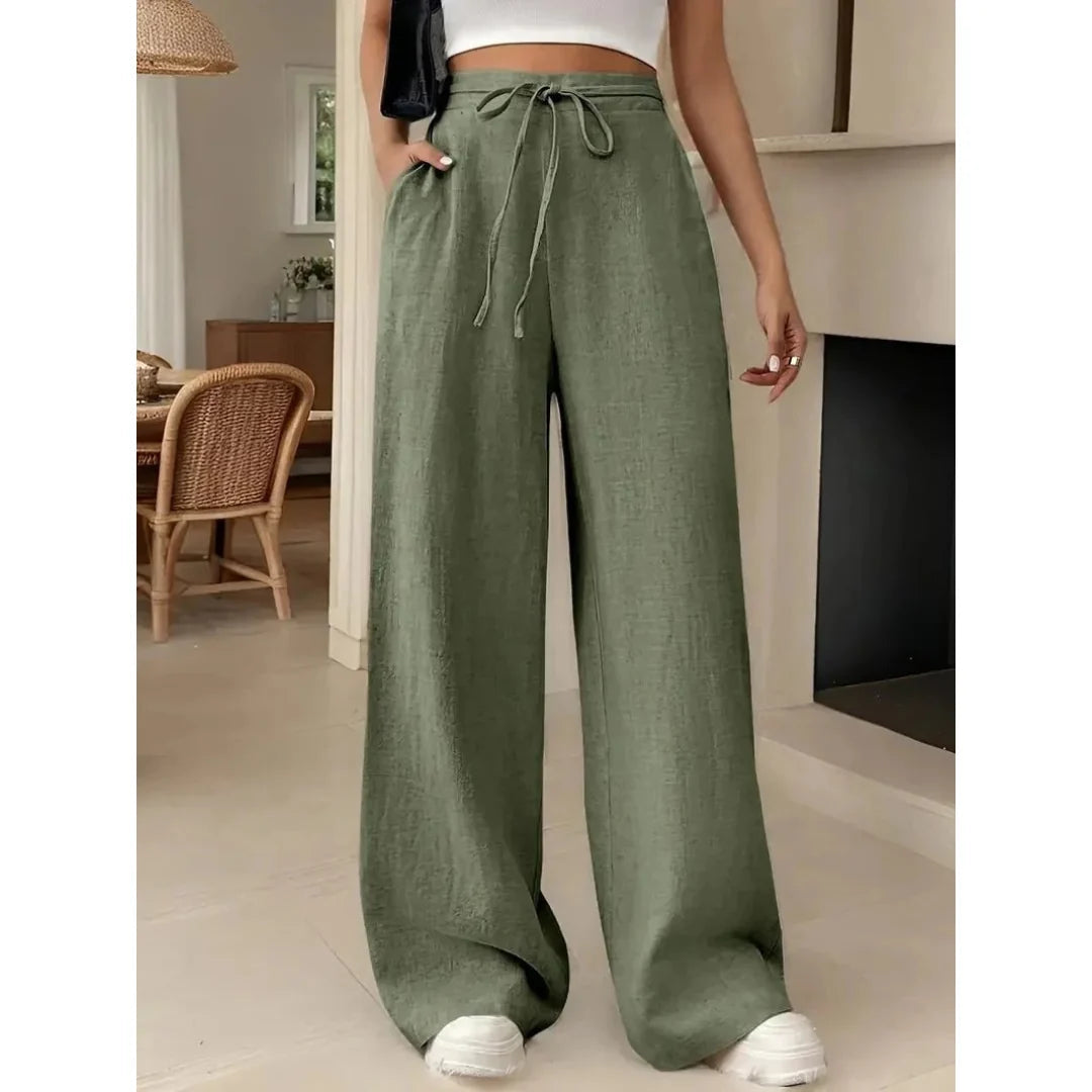 Pantalon large femme décontracté avec taille à cordon, poches pratiques, tissu fluide pour printemps-été. Confortable et chic.