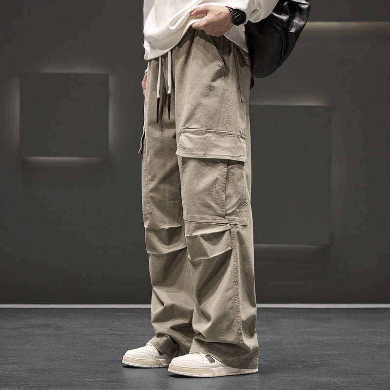 Pantalon cargo homme, coupe large moderne avec multiples poches. Idéal pour un look décontracté et pratique.