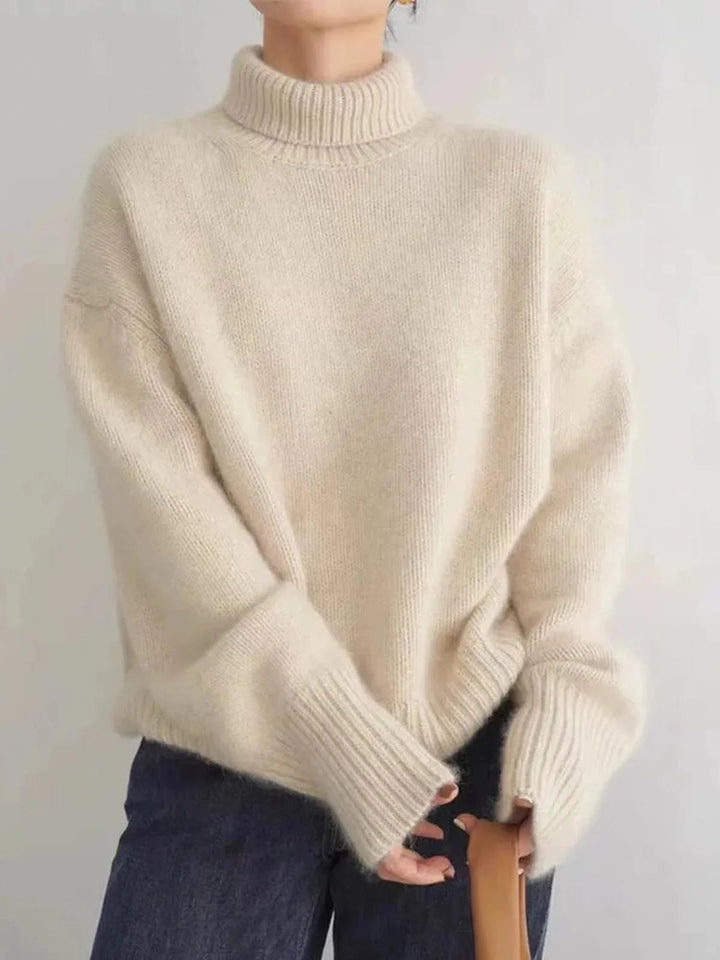 Pull col roulé femme chaud en maille épaisse, parfait pour l'hiver et l'automne. Confortable et élégant.