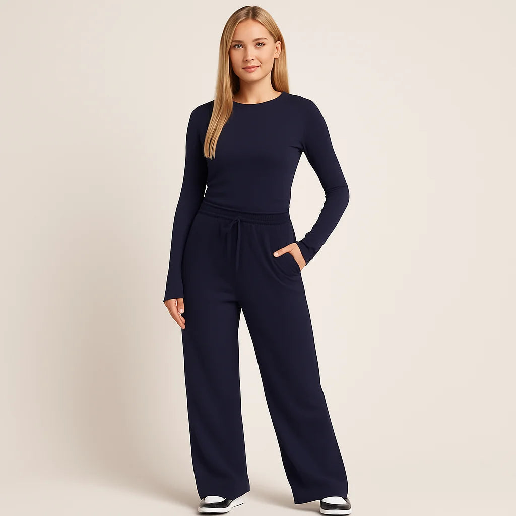 Ensemble femme élégant deux pièces: haut manches longues et pantalon large taille haute, mode automne-hiver.