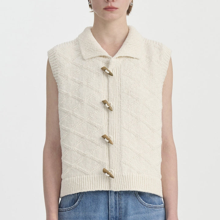Gilet femme sans manches élégant, motif losange texturé. Ajoute une touche vintage à votre style automnal.